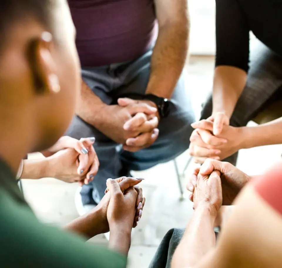 Hands clasped together in support